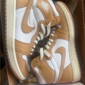 Nike Jordan’s women’s Tan and White High-Top Sneakers